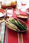 Grilled leeks with sauce in bowls — Stock Photo
