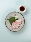Japanese rice dessert with leaf and sauce — Stock Photo