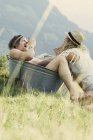 Couple playing in metal tub outdoors — Stock Photo