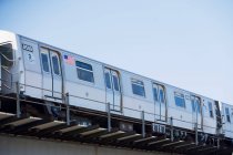 Subway train with american flag sign, New York City, USA — Stock Photo