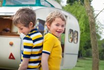 Two boys outside caravan, portrait — Stock Photo