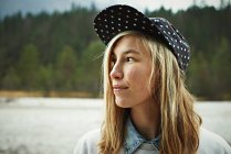Portrait of woman wearing cap headwear — Stock Photo
