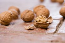 Walnuts on wooden table — Stock Photo
