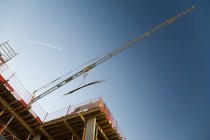 Bottom view of crane on a construction site — Stock Photo