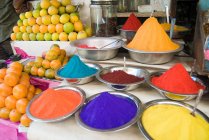 Close up of color Tikka powder market stall — Stock Photo
