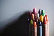 Closeup shot of stack of colourful wax crayons — Stock Photo