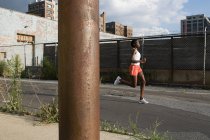 African american Woman running in brooklyn — Stock Photo