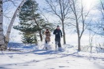 Two beautiful friends playing in the snow, Montreal, Quebec, Canada — Stock Photo