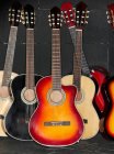 Close up shot of acoustic guitars in row — Stock Photo