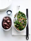 Chickpea salad with lamb in bowls — Stock Photo