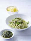 Still life of vegetable spaghetti with chicken pesto on table — Stock Photo