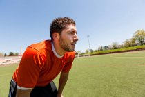 Soccer player taking a break on pitch — Stock Photo