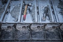 Repairs being made to bulldozer tracks at surface coal mine, close up — Stock Photo