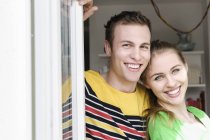 Portrait of young smiling couple — Stock Photo