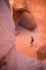 Hiker exploring rock formations — Stock Photo