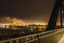 Distant view of oil storage tanks on Puget Sound waterfront at night, Tacoma, Washington State, USA — Stock Photo