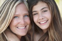 Portrait of mother and daughter looking at camera — Stock Photo