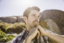 Mid adult man, outdoors, looking away in thoughtful pose — Stock Photo