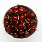 White bowl of cherries — Stock Photo