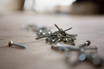 Close up of Screws on the floor, differential focus — Stock Photo