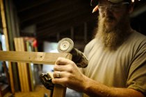 Wood artist working in workshop — Stock Photo