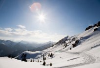Way through snowy mountain landscape — Stock Photo
