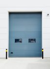 Closed warehouse door, front view — Stock Photo