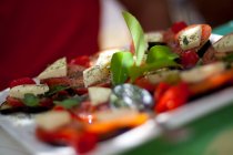 Tomatoes and mozzarella on plate — Stock Photo