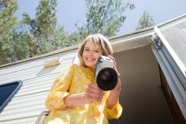 Young woman with a video camera — Stock Photo