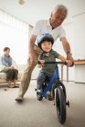 Boy learning to ride bicycle — Stock Photo