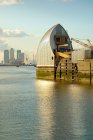 Thames barrier with river and cityscape on background, London, UK — Stock Photo