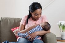 Mother holding baby son — Stock Photo