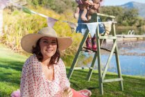Woman wearing sun hat outdoors — Stock Photo