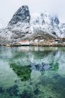 Snowcapped mountain reflected in water — Stock Photo