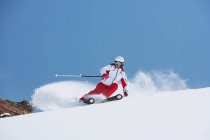 Skier coasting on snowy slope — Stock Photo