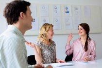 Businesswomen high fiving in office, selective focus — Stock Photo
