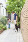 Father and young son on path with dog — Stock Photo