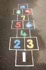 Colorful Hopscotch painted on concrete at playground — Stock Photo