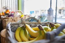 Basket with bananas on market — Stock Photo