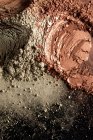 Brown, black and gray cosmetic powder pattern — Stock Photo