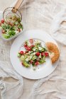 Salad with fresh bread — Stock Photo
