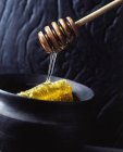Honey comb in pot — Stock Photo