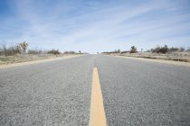 Highway through Californian salt flats — Stock Photo