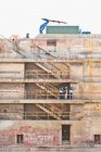 Workers talking on steps on dry dock — Stock Photo