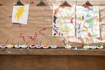 Children paintings, hanging to dry — Stock Photo