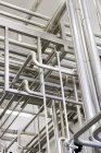 Low angle view of industrial piping in a factory — Stock Photo