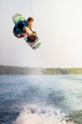 Male wakeboarder in air — Stock Photo