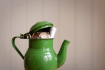 Money placed in teapot — Stock Photo