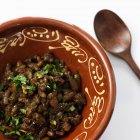 Bowl of beans with herbs — Stock Photo