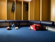 Rugby team changing room with empty ambry and gym bags — Stock Photo